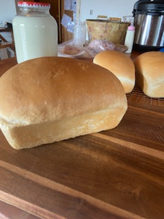 Easy Soft Sandwich Bread Recipe on a wooden counter.