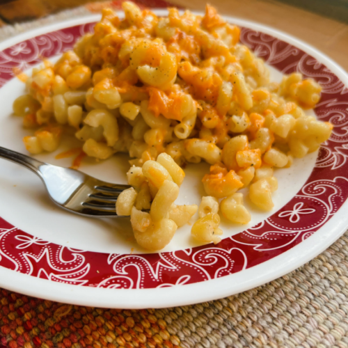 A large plate of white sauce mac & cheese.