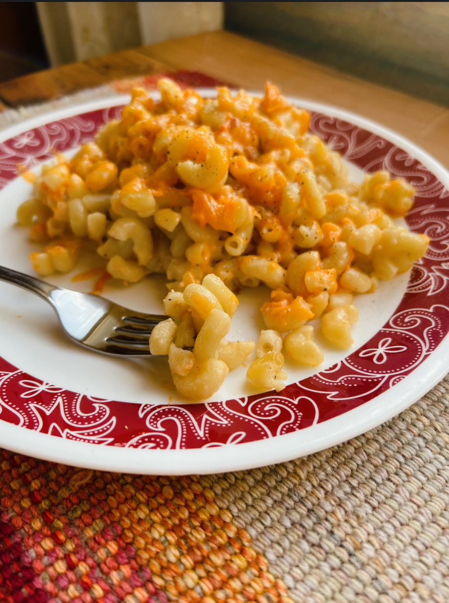 A large plate of white sauce mac & cheese.