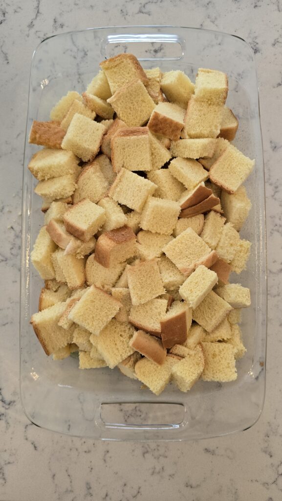 Sliced bread in a glass casserole dish.