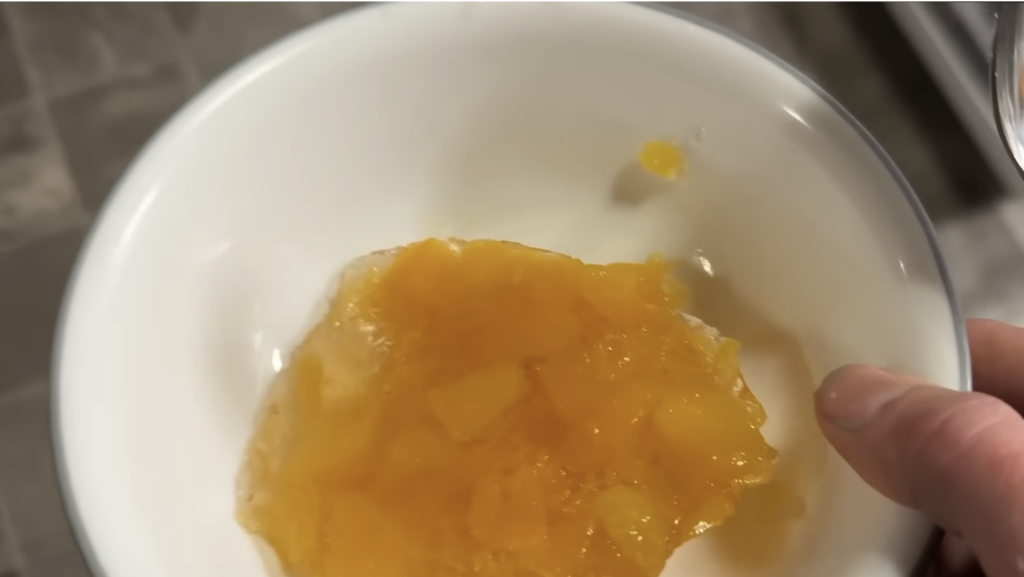 A bowl of homemade peach jello.
