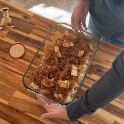A prepared glass tray of Brown Betty to go in the oven.