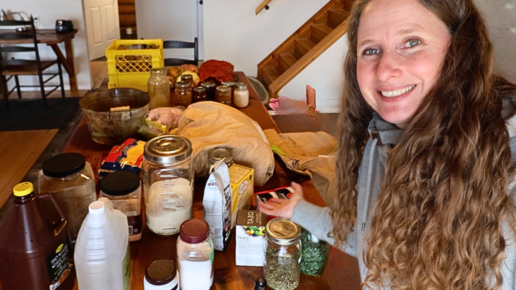 Chelsea in front of a table covered in foods that are What a Rural Family Ate During the Great Depression.