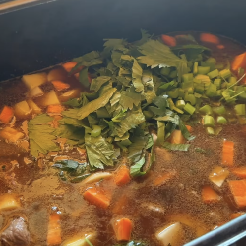 Stew ingredients in a large roasting oven to be cooked for 24 hours.