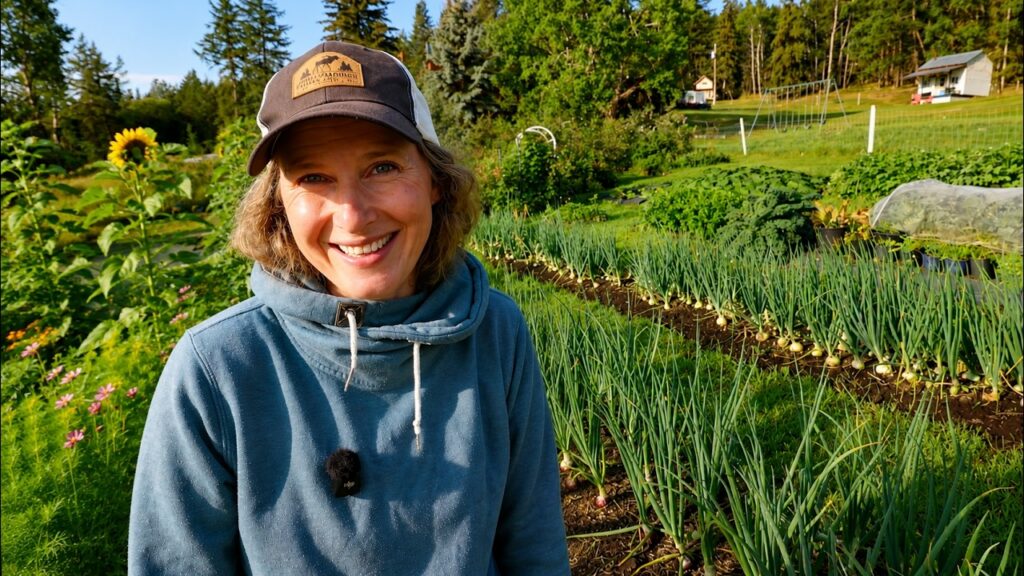 Chelsea standing in her garden smiling.