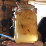 A jar of spiced peaches with cardamom.